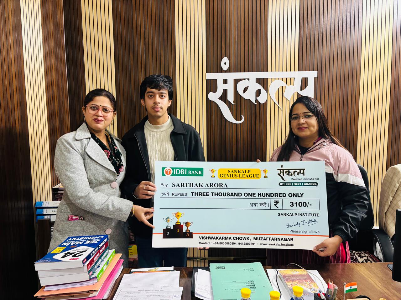 Sarthak Arora receiving prize